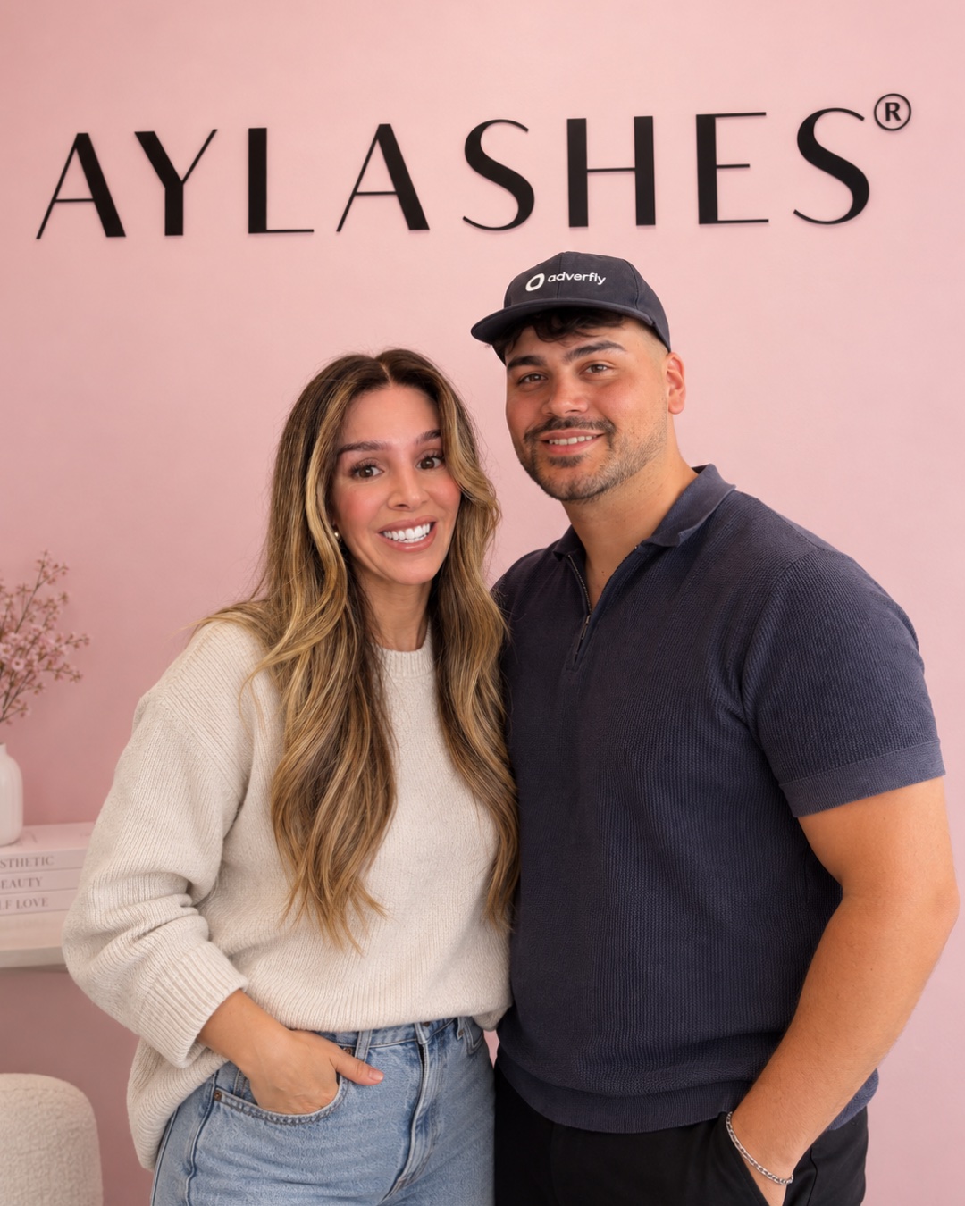 Aylin, founder of AYLASHES, and Ezhan Atak of Adverfly in front of the AYLASHES lettering